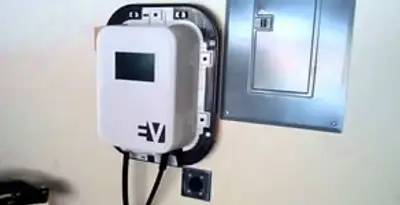 Electric car charger installation with wall-mounted EV charging station in Waltham, MA