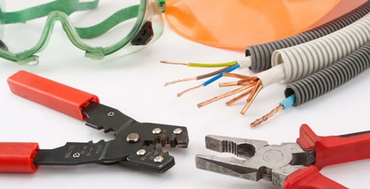 Electrical wiring repair with professional tools and safety equipment in Belmont, MA
