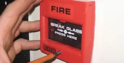 fire alarm installation service showing manual fire alarm pull station installed by licensed electricians in Waltham, MA