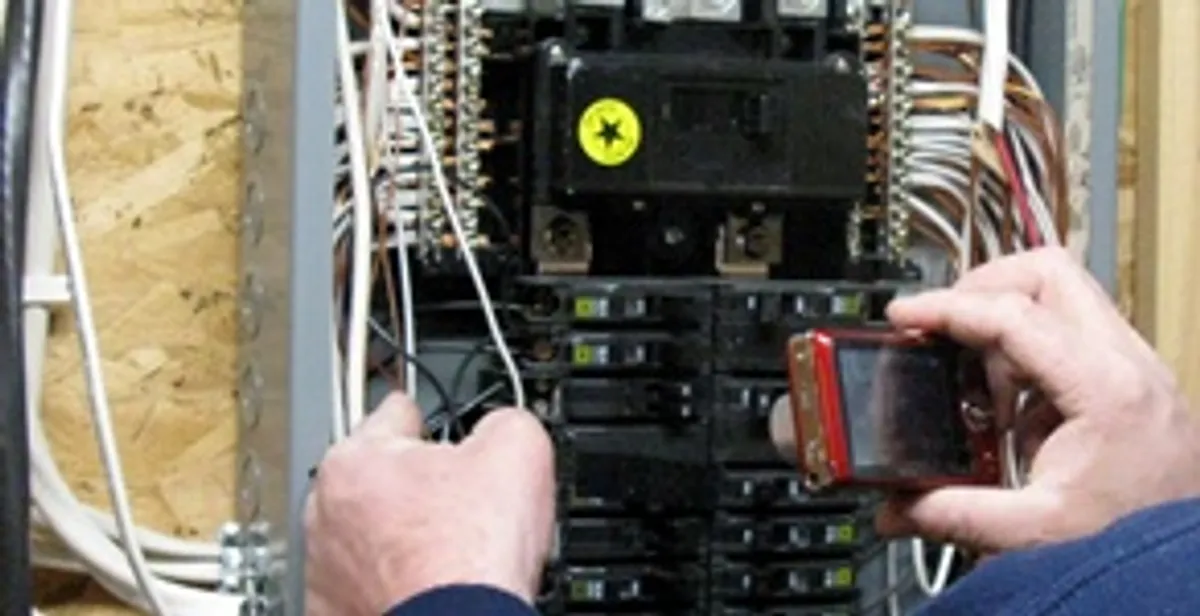 Home electrical inspection of circuit breaker panel by licensed electrician in Waltham, MA
