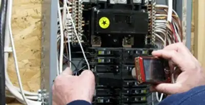 Home electrical inspection of circuit breaker panel by licensed electrician in Waltham, MA