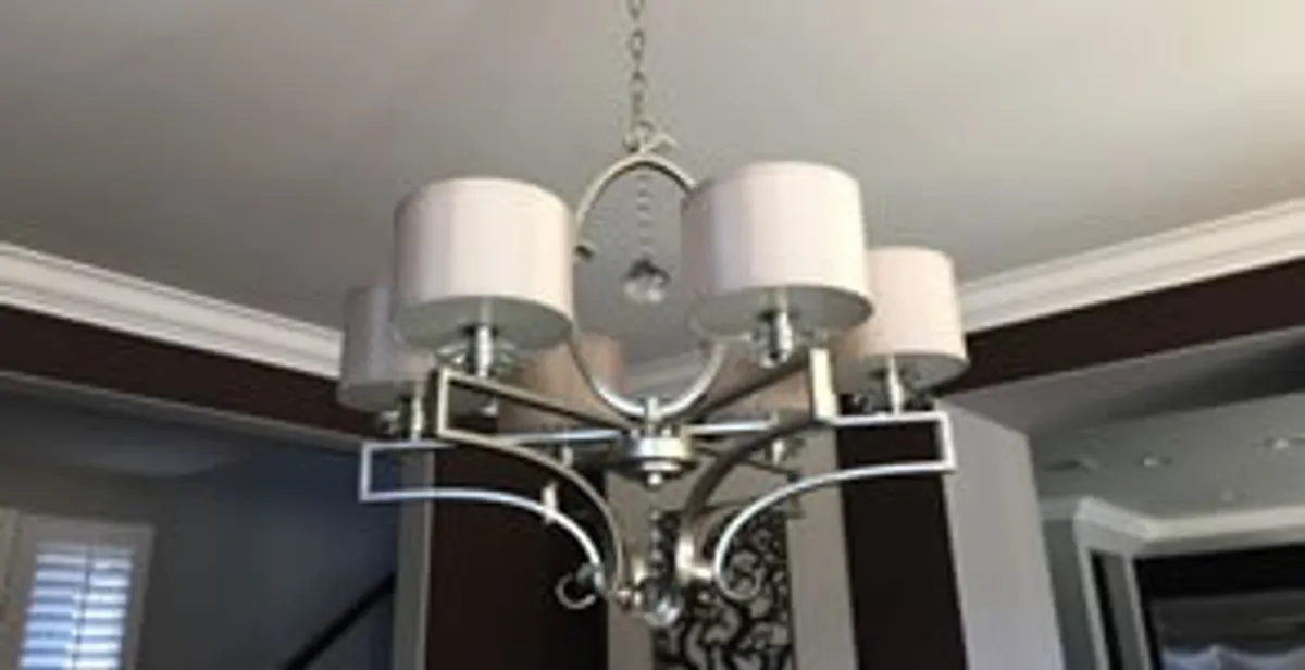 Modern chandelier installation with multiple light fixtures in Waltham, MA