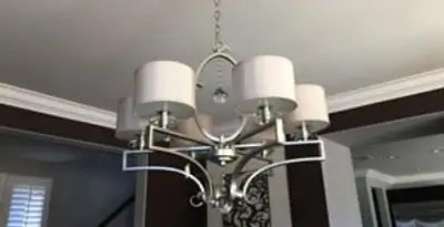 Modern chandelier installation with multiple light fixtures in Waltham, MA