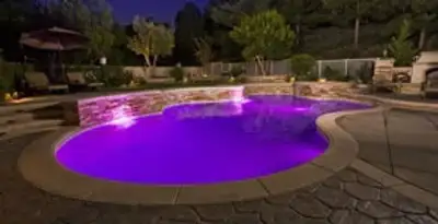 pool light installation and repair services illuminating a residential swimming pool in Waltham, MA