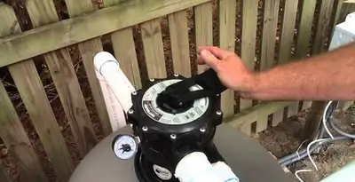 pool pumps service showing professional adjustment of pool pump control system in Waltham, MA