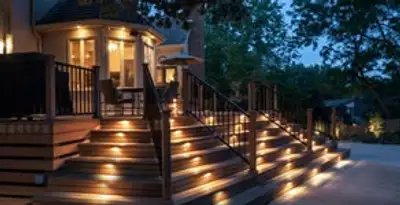 Residential electrician installing outdoor lighting for home safety in Waltham, MA